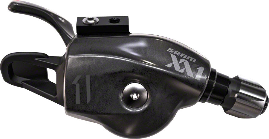 Mando de cambio SRAM XX1 de 11 velocidades con gatillo y logotipo en negro. Abrazadera del manillar. Carcasa del cable.